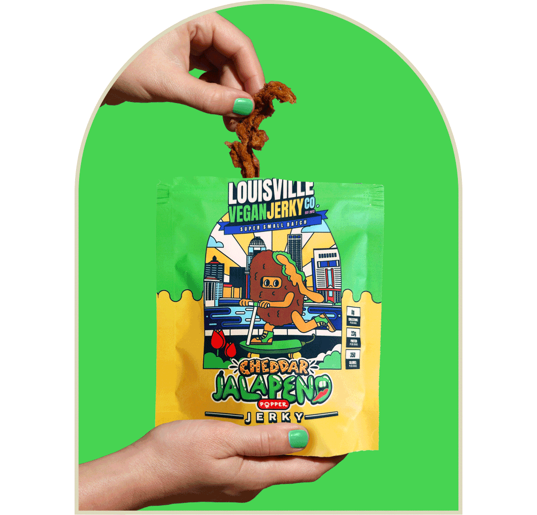 Hands holding bag of Cheddar Jalapeno vegan jerky with "Jerky Coins" surrounding arch frame.