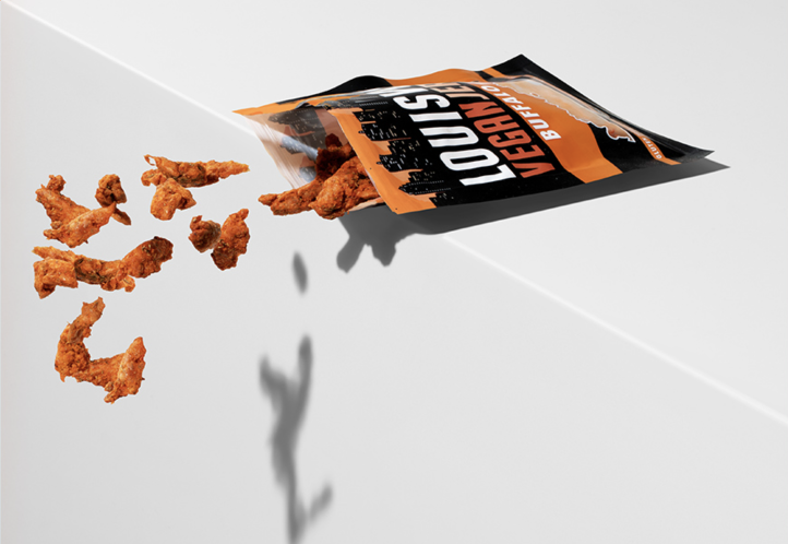 Bag of Buffalo Dill Jerky spilling on the edge of white surface.